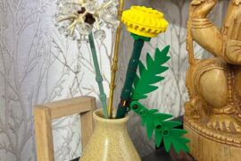 Had an empty reed diffuser's vase laying around. Decided to add Lego flowers to it. Def a good idea :)