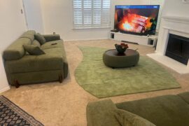 Leaning into the green tones in the living room. Does this rug placement work?