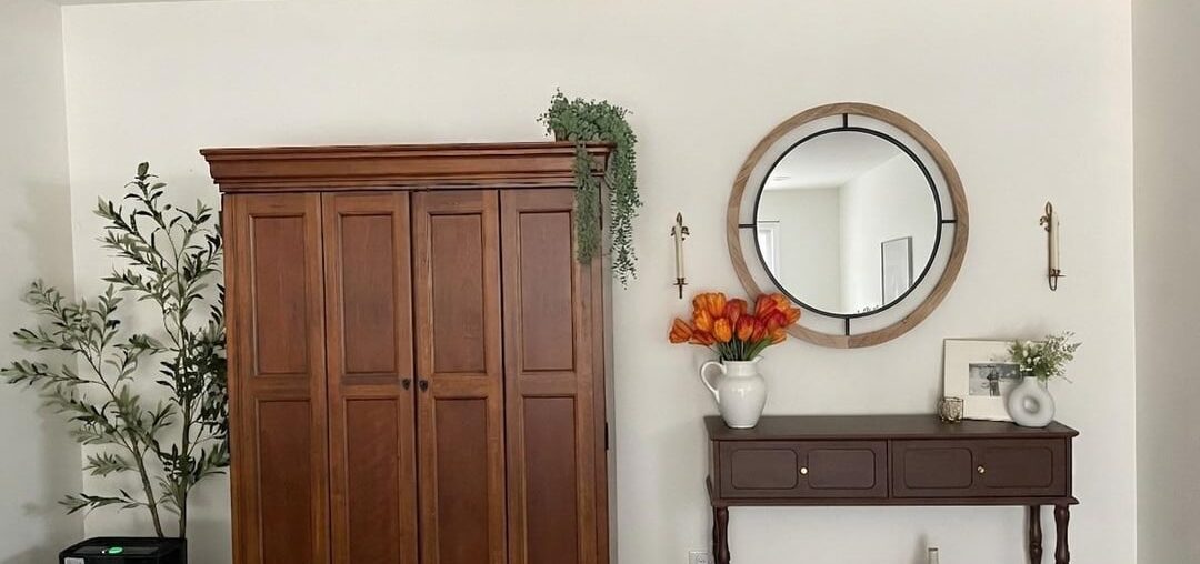 Ok does it look less somber and funeral home-y? Didn’t purchase the mirror yet but everything else is how it’s set up right now- brighter flowers, picture moved, etc