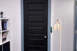 I’m giving my windowless spare bedroom a makeover. Should I paint my door blue or leave it black?