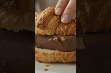 🥐✨ Trying a delicious French croissant with a Magnum twist! 🍫🤎 Would you try this combo?